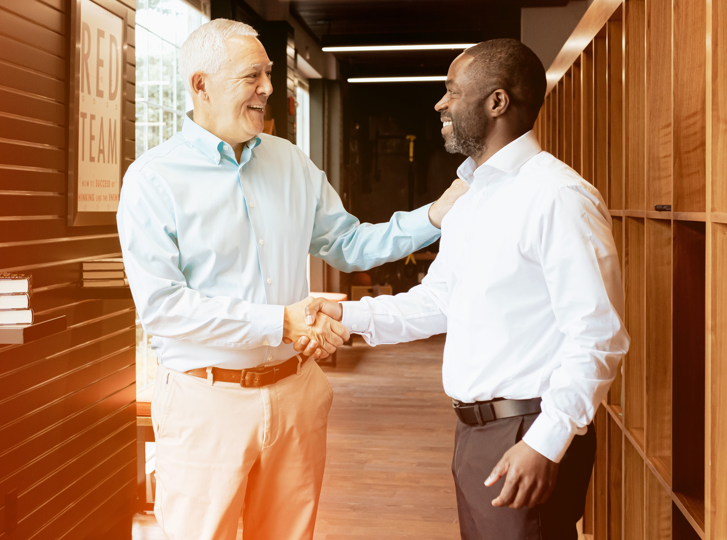 Two Men Shaking Hands and Smiling