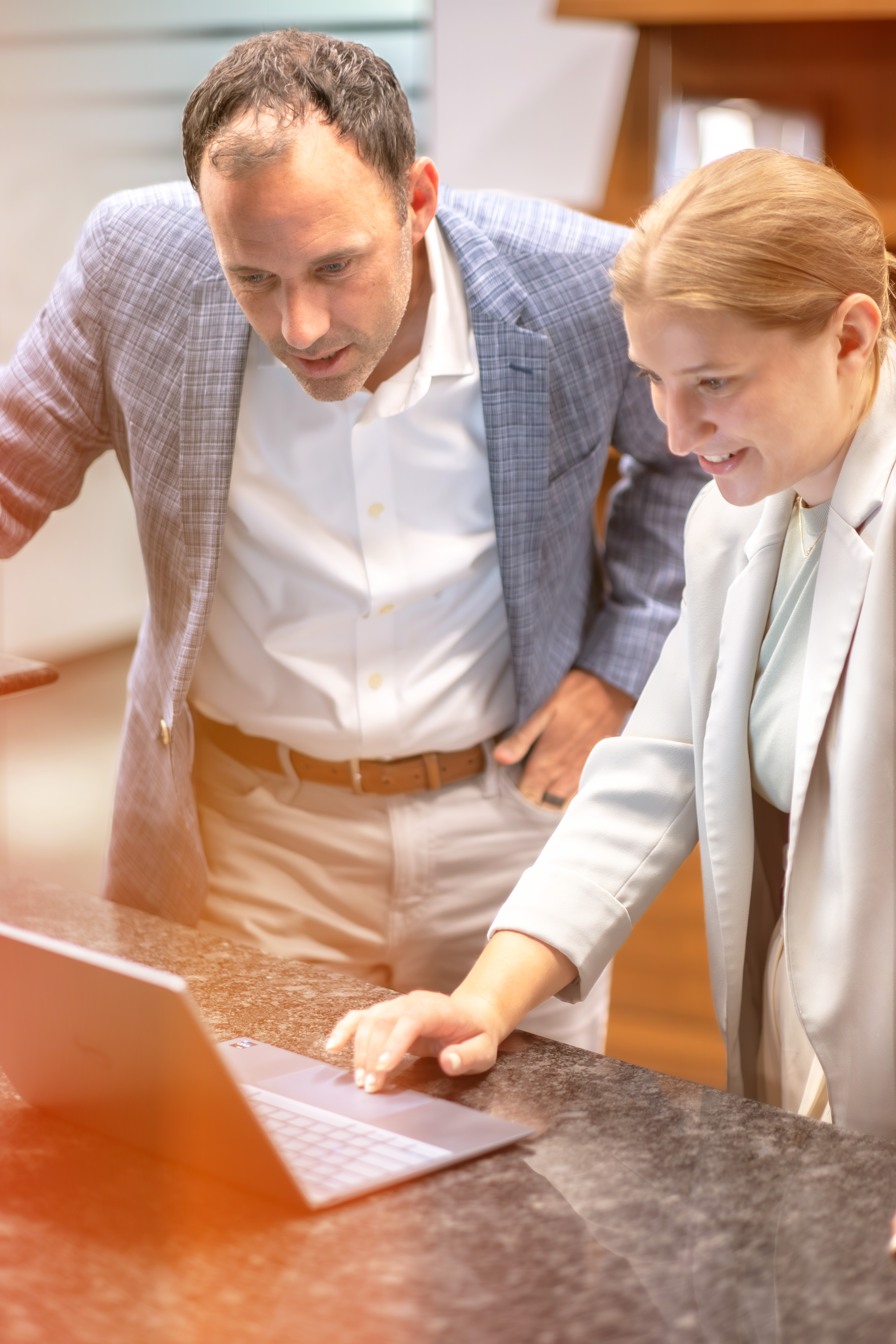 Man and Women Working Together on Computer